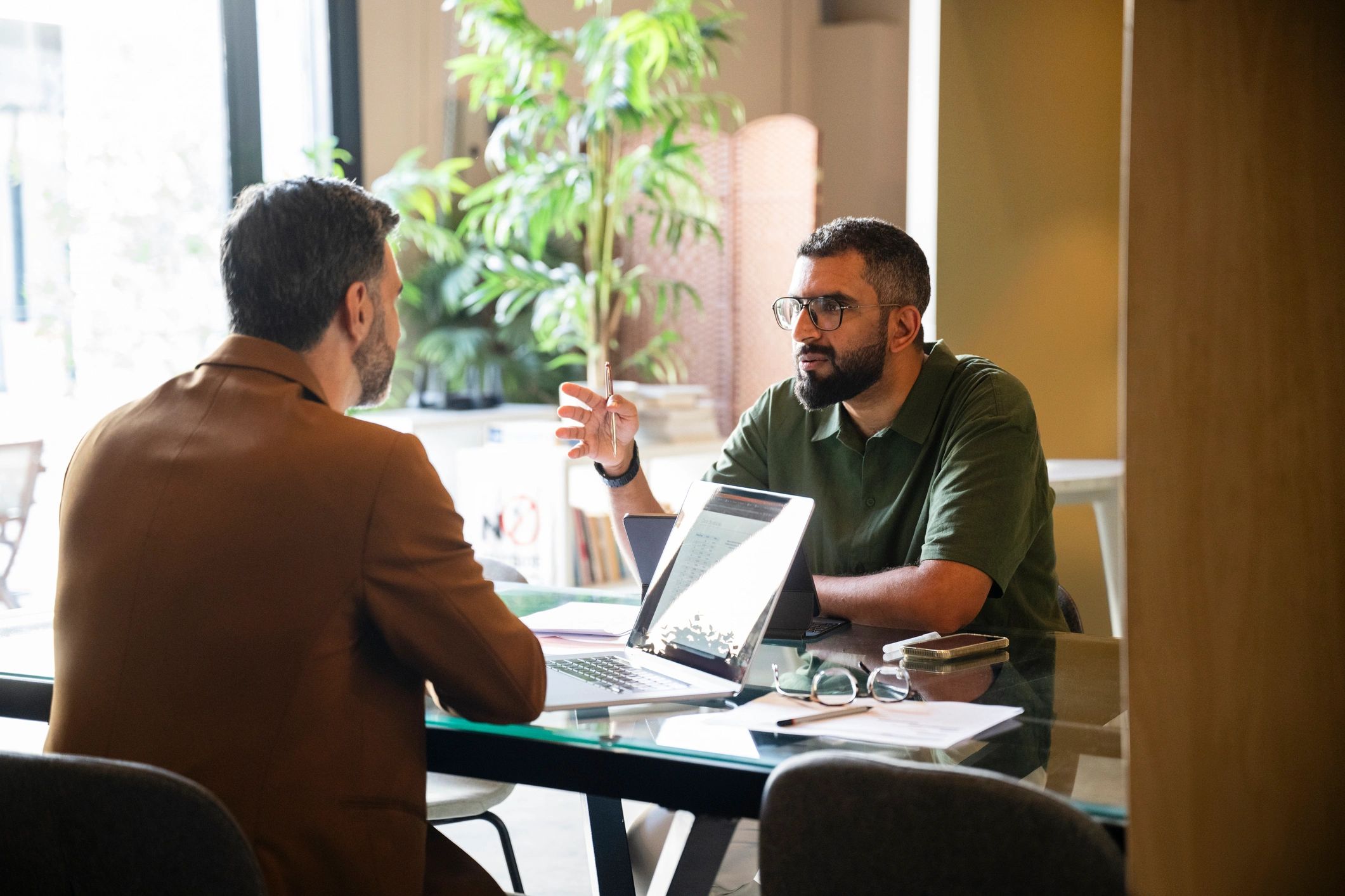 Business coach meeting with an entrepreneur to review goals and strategy